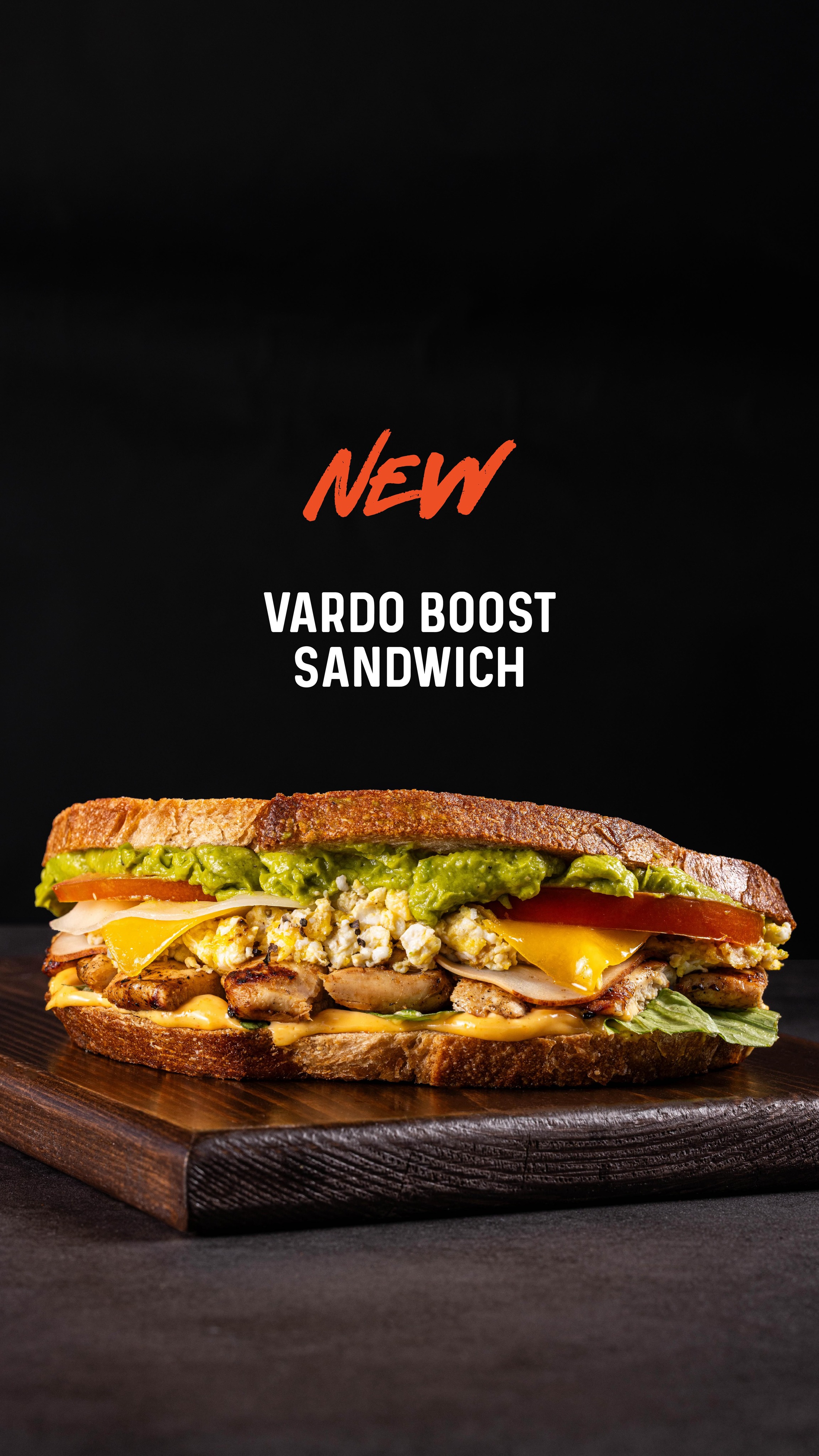 A stack of three Vardo burgers — fried chicken, beef and grilled chicken